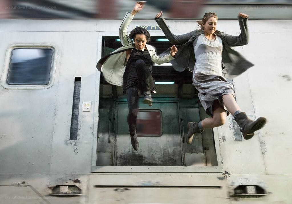 Women jumping from a moving train