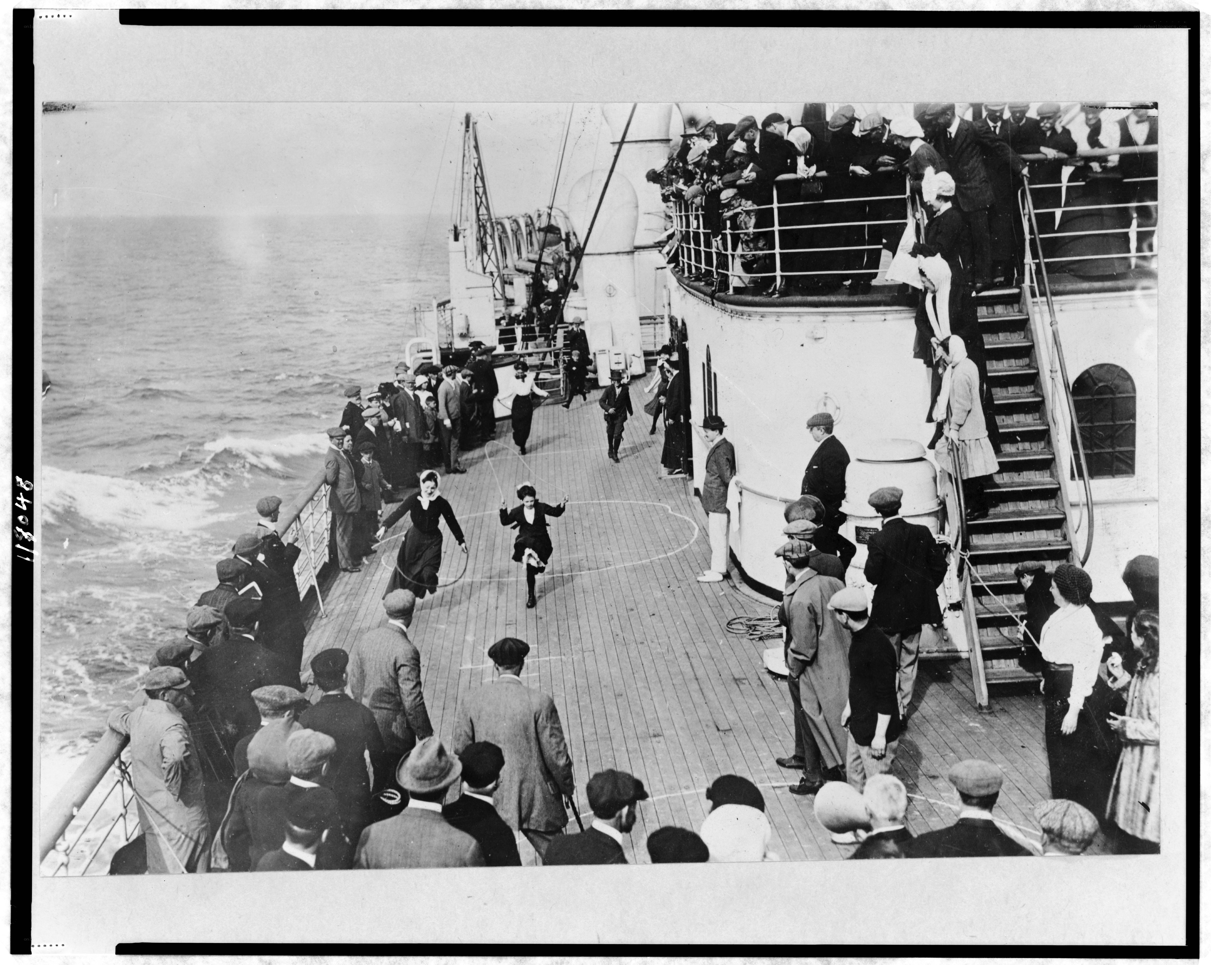 Women jumping rope on a ship deck