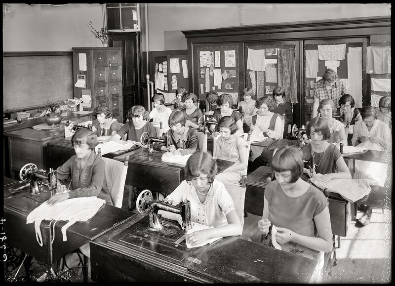 Women learning sewing in a classroom