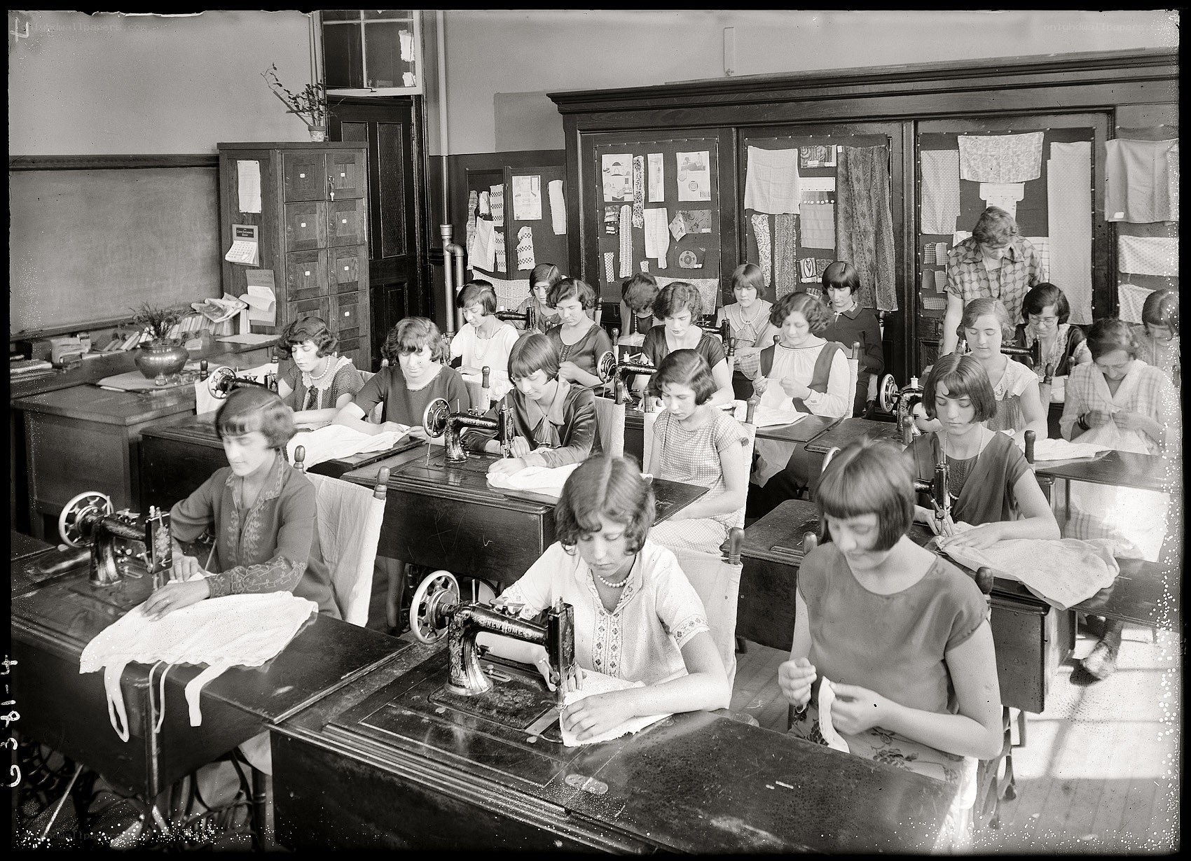 Women learning sewing in a classroom
