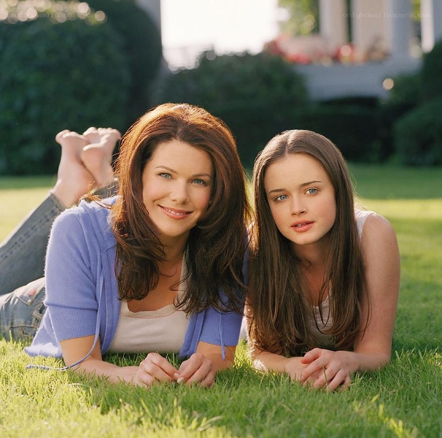 Women lying on grass together