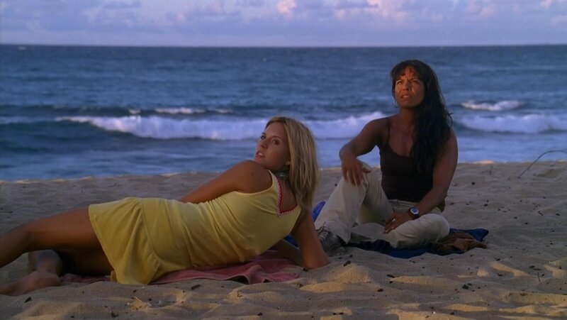 Women on a beach at dusk