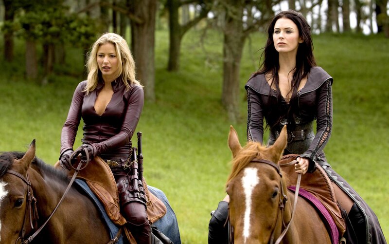 Women on horseback in forest