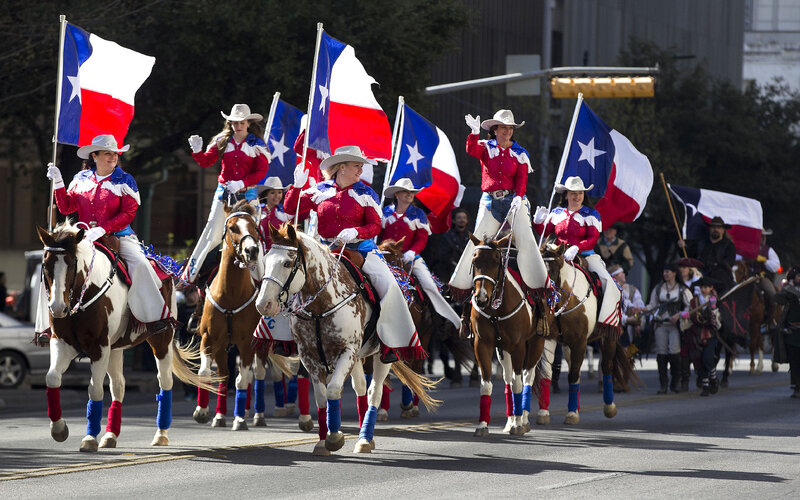 Women on Horses in Parade — Red