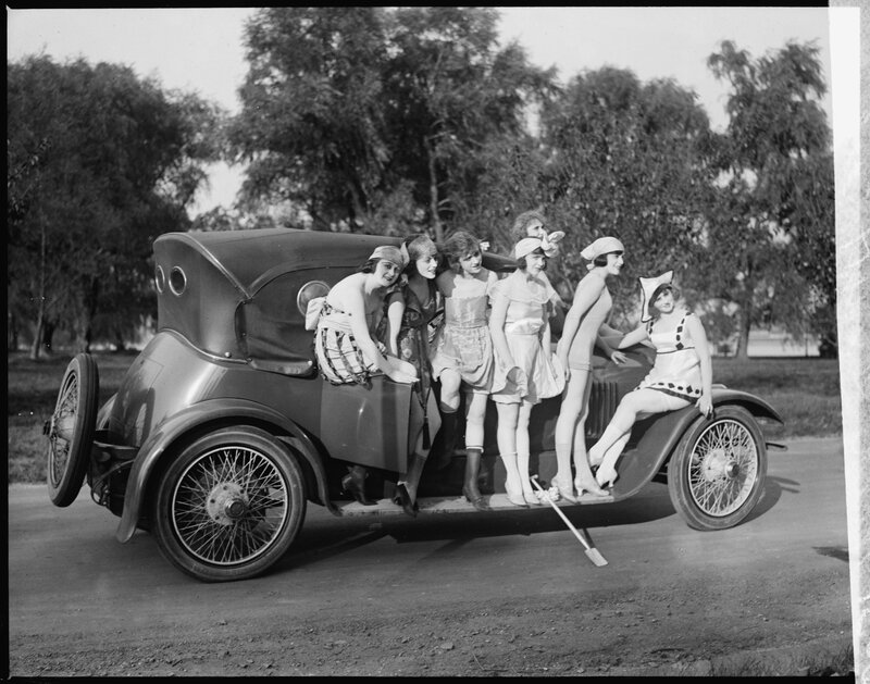 Women on vintage car