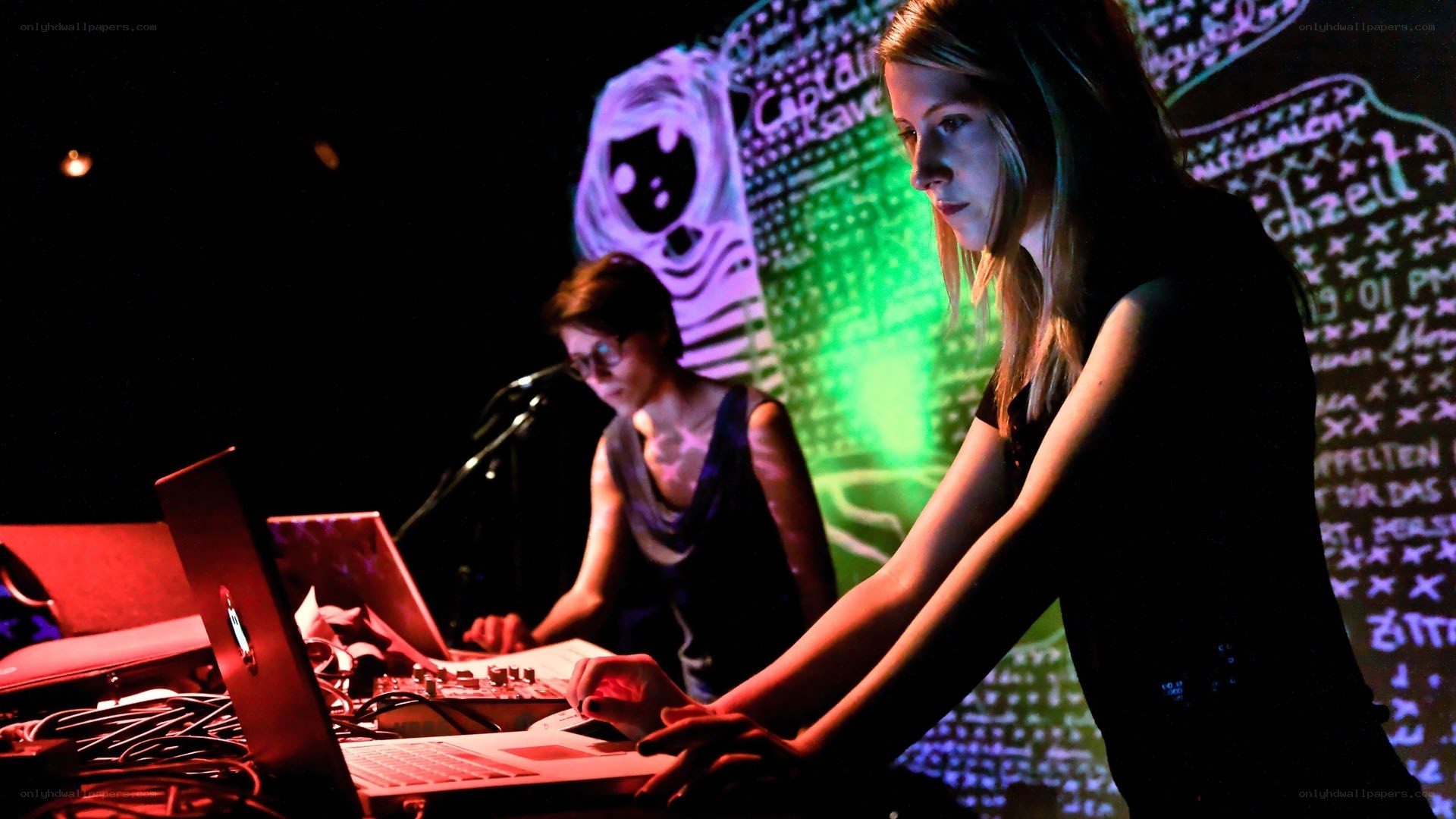 Women performing with laptops