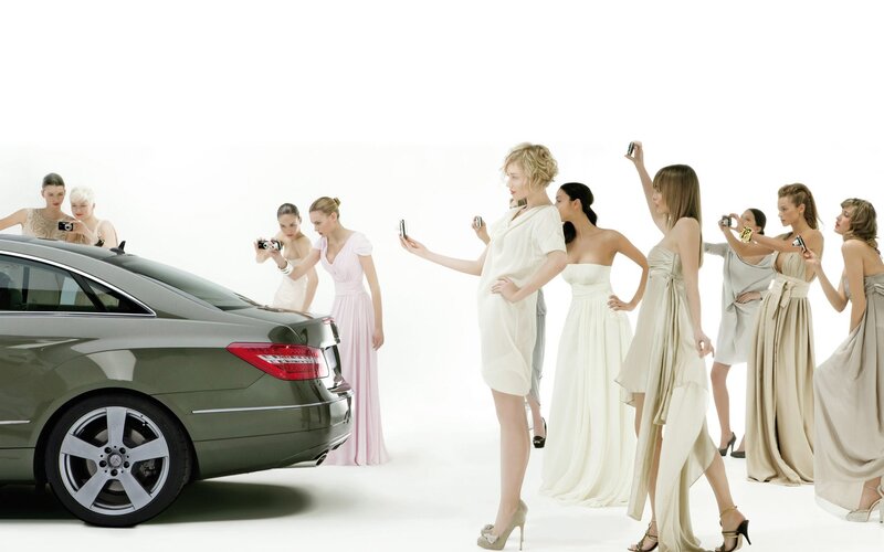 Women photographing a car