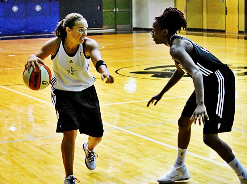 Women playing basketball