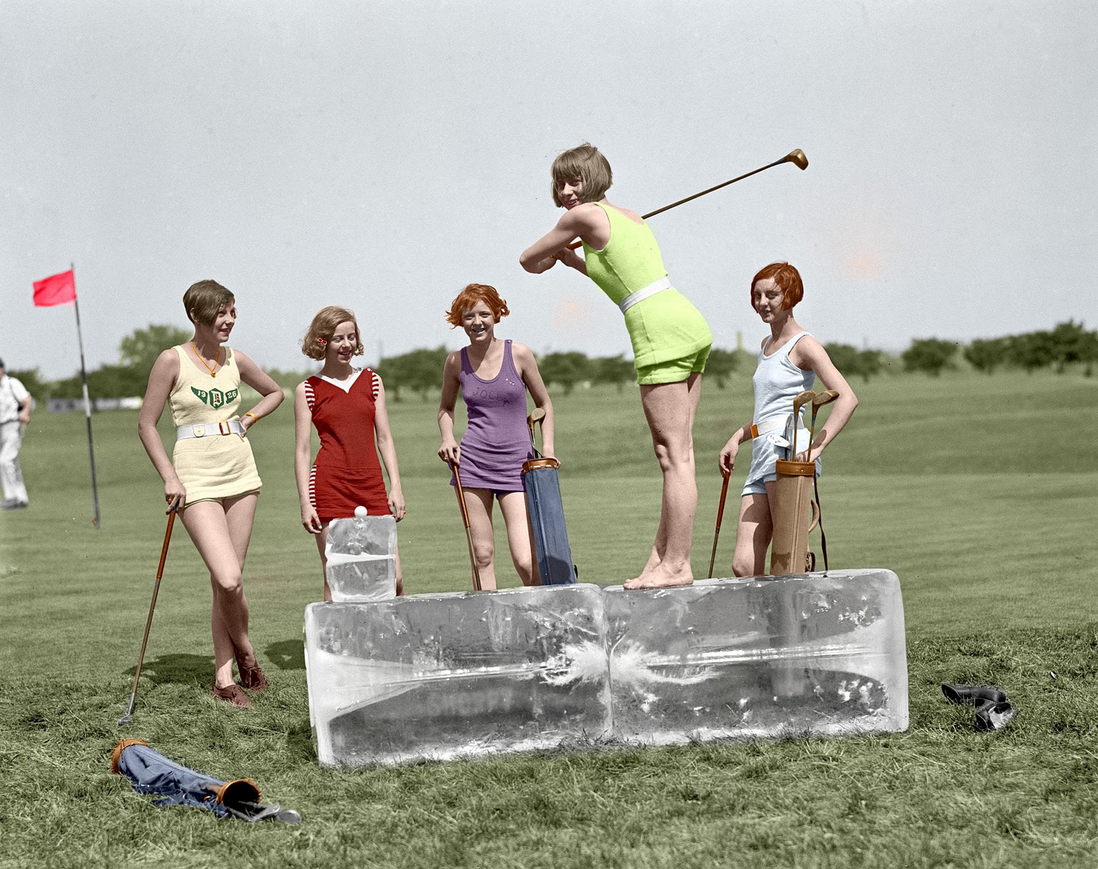 Women playing golf on ice blocks