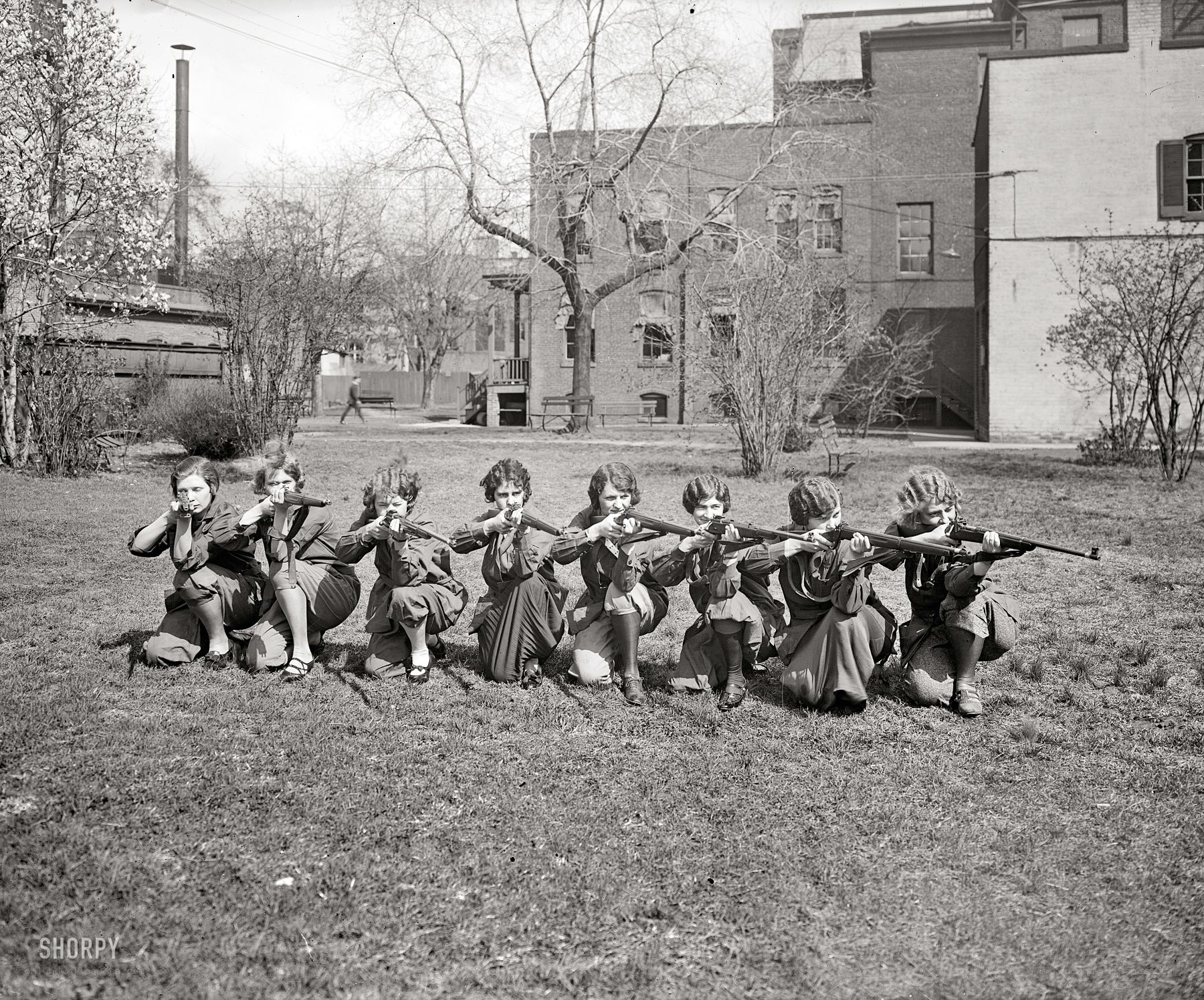 Women posing with rifles