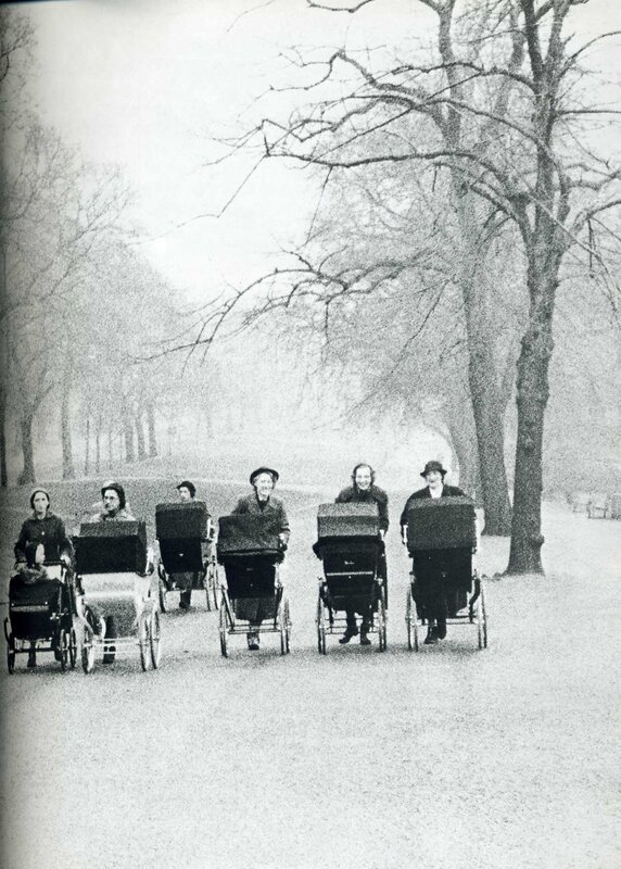 Women pushing baby carriages