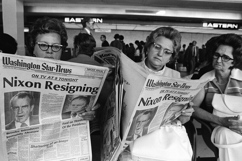 Women reading Nixon resignation news
