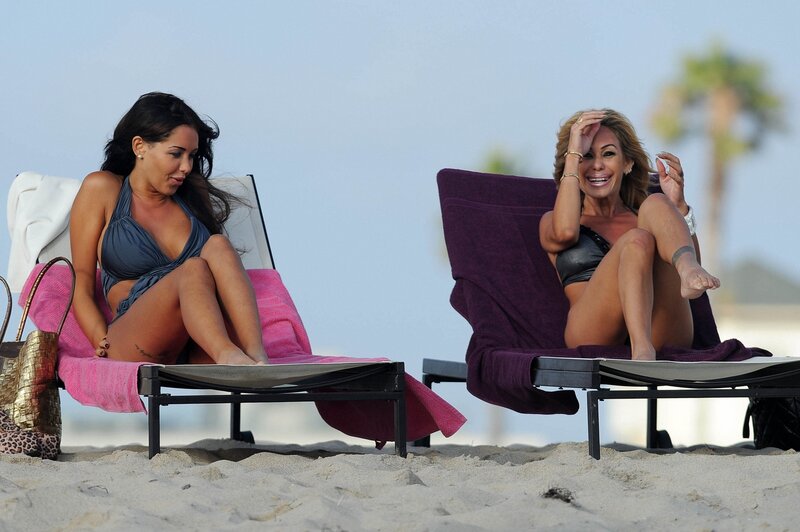 Women relaxing on beach chairs