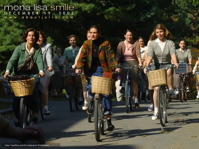 Women riding bicycles in park