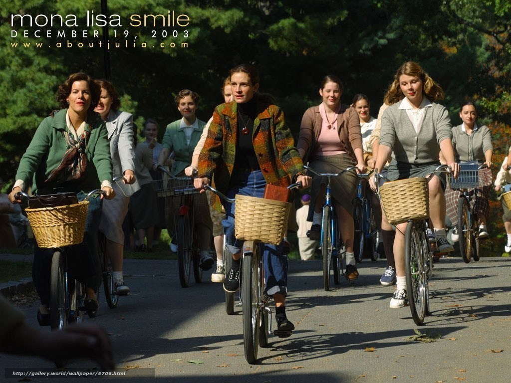 Women riding bicycles in park