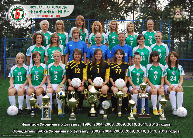 Women's football team with trophies
