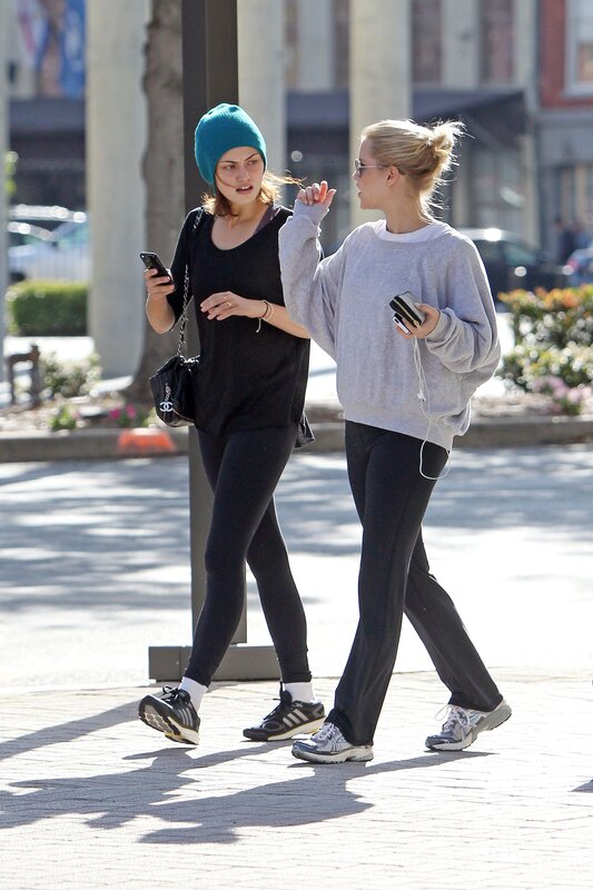 Women walking on a city sidewalk