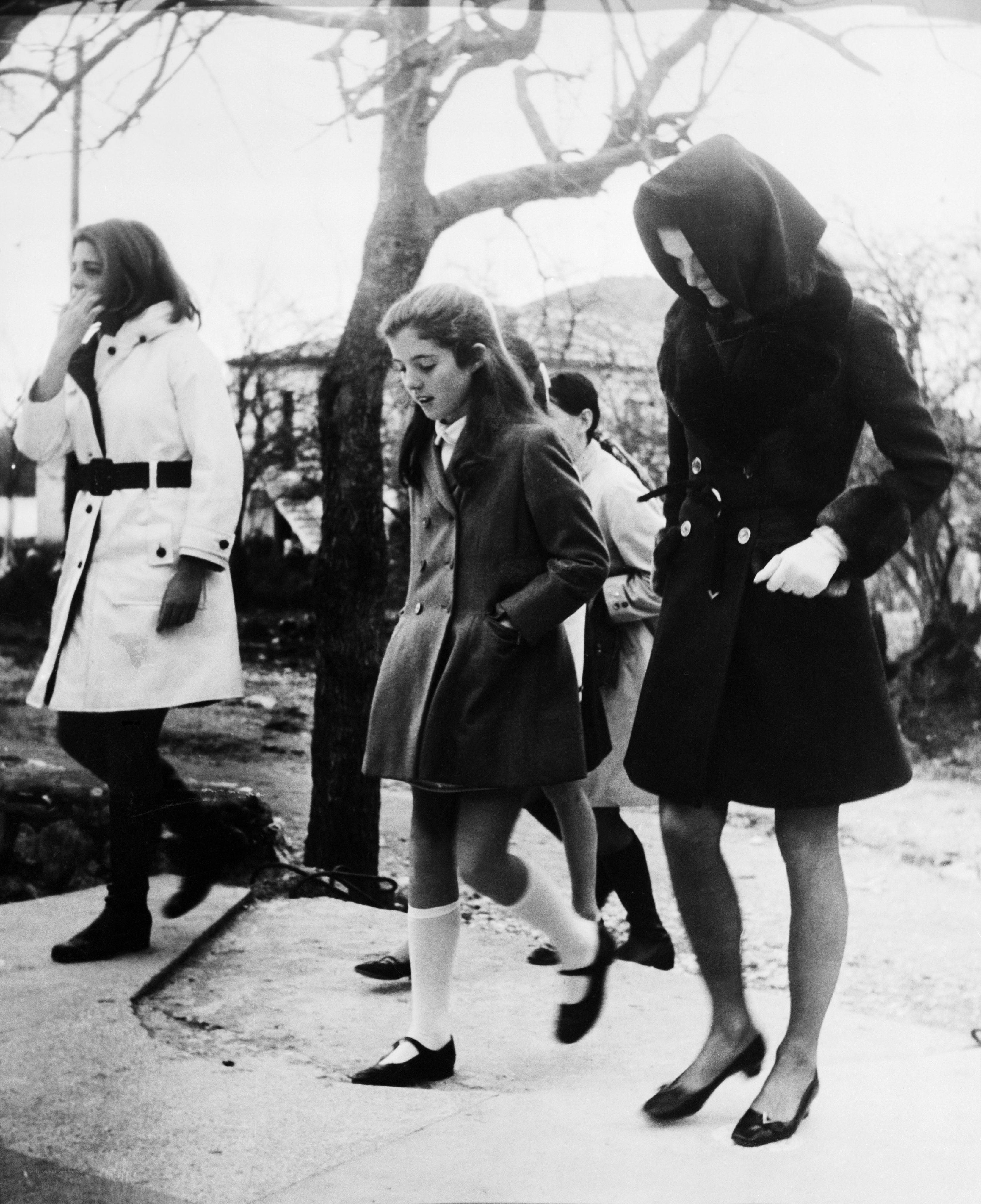 Women walking on a sidewalk