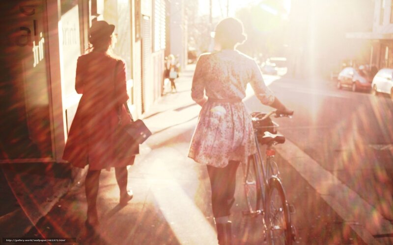 Women walking on a sunlit street