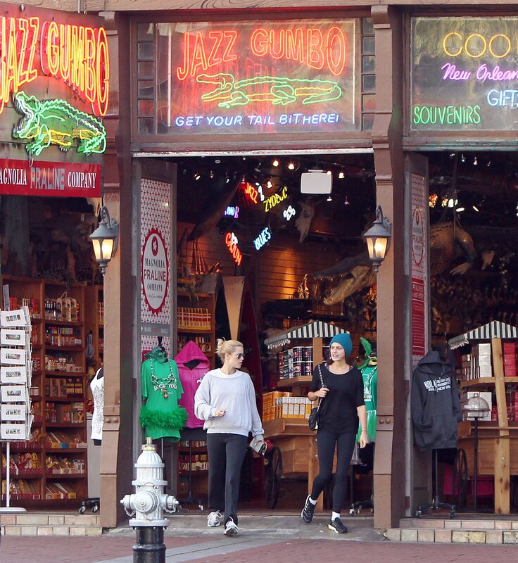 Women walking past Jazz Gumbo shop