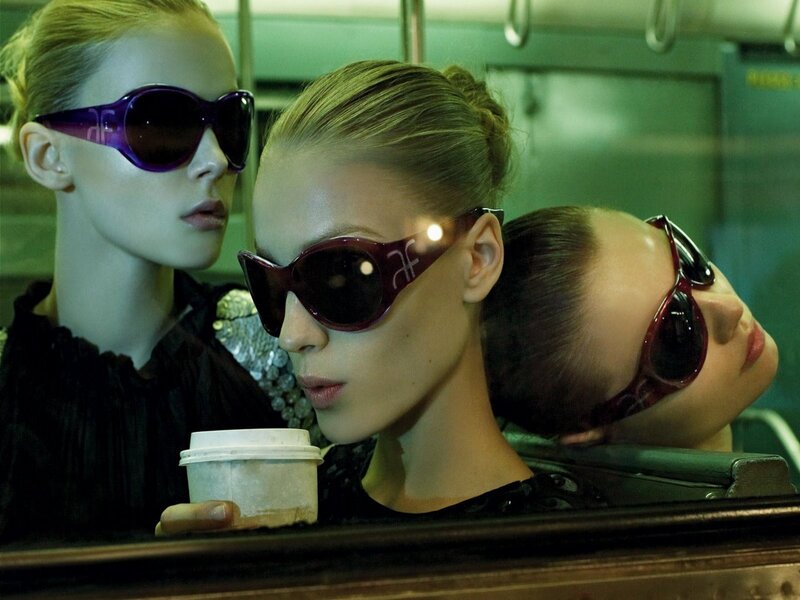 Women wearing sunglasses on transit