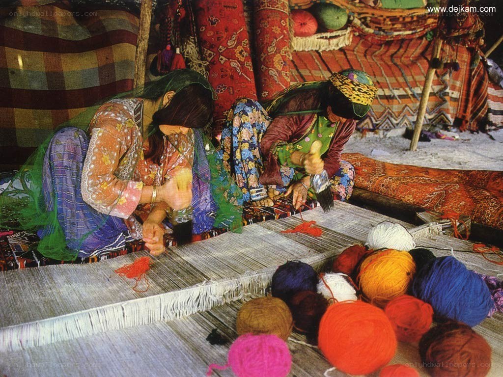 Women weaving carpets