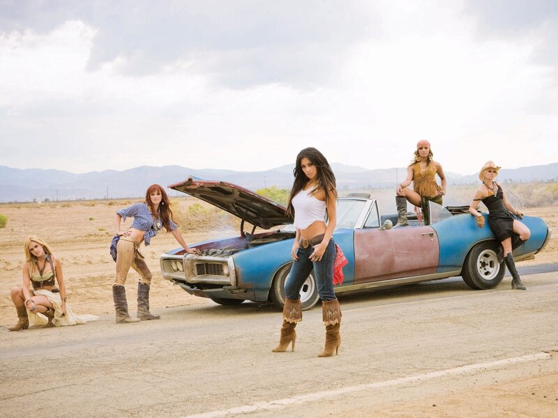 Women with a classic car