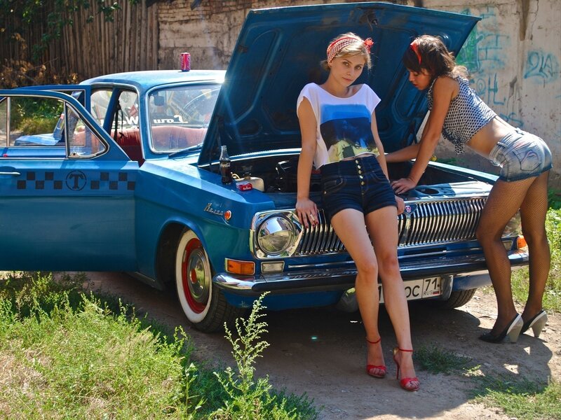 Women with a vintage car