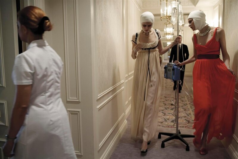 Women with bandages in hallway