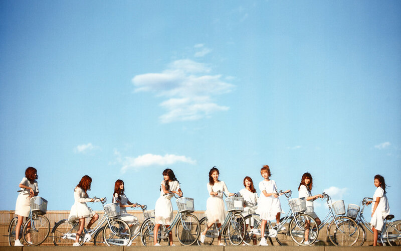 women with bicycles on a sunny day