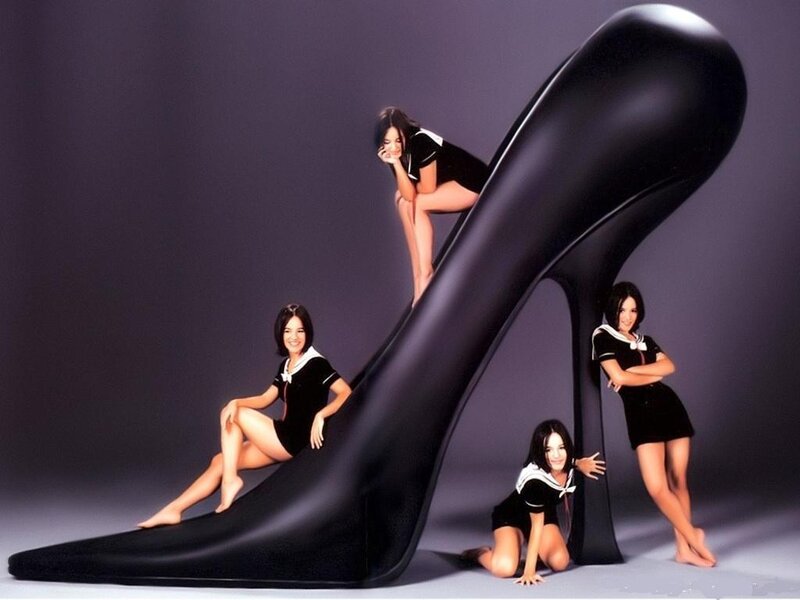 Women with giant high-heeled shoe