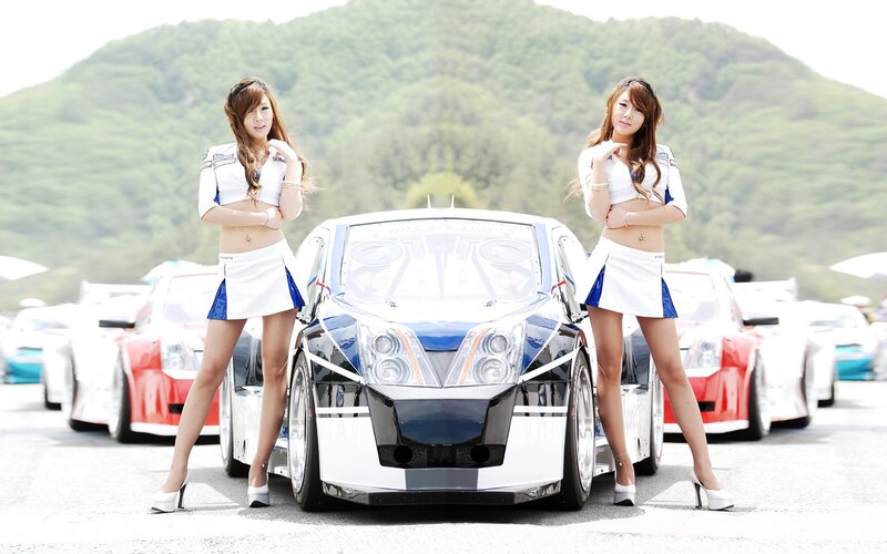 Women with race car at event
