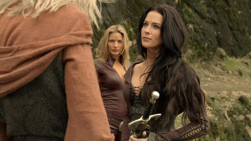 women with swords in forest