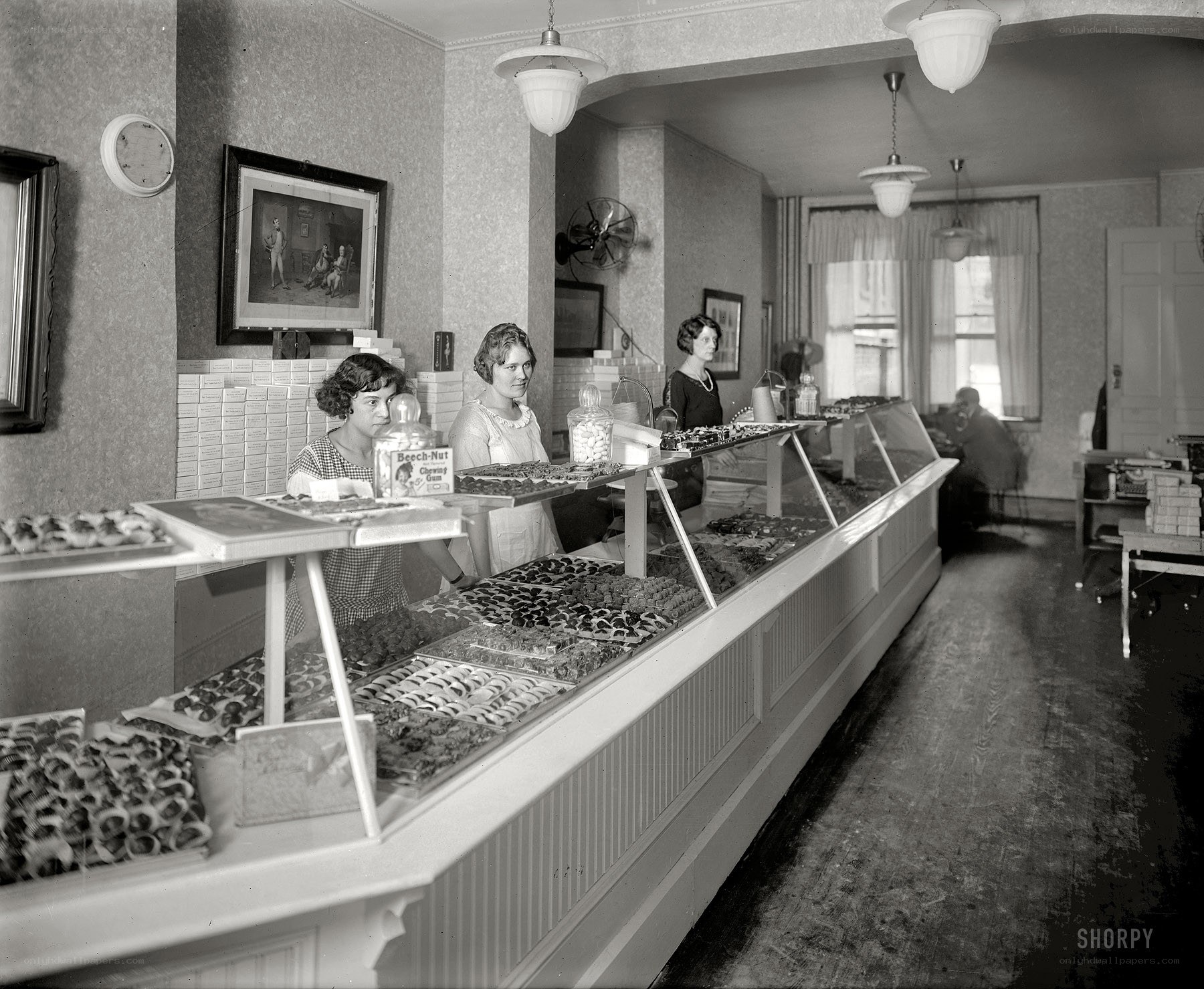 Women working in a candy store