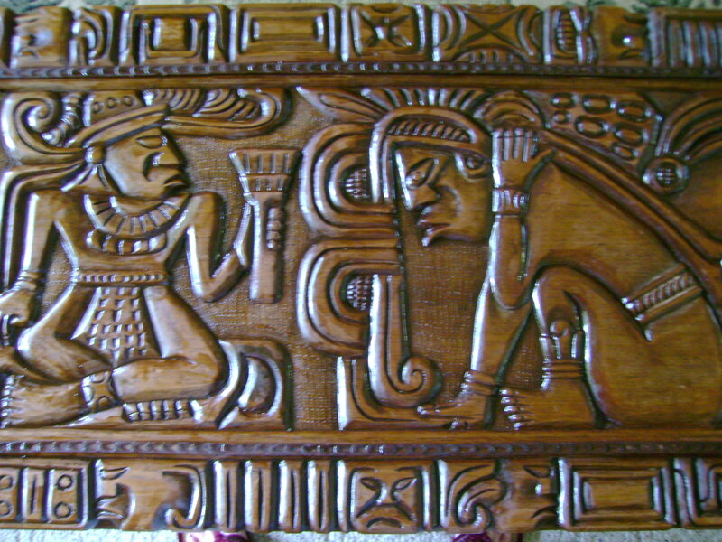 wood carving of ancient figures