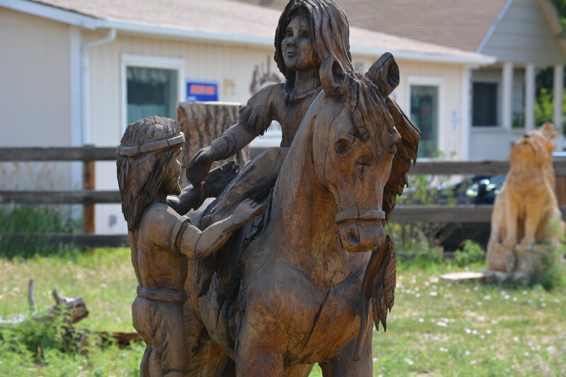 Wood Carving of People and Horse