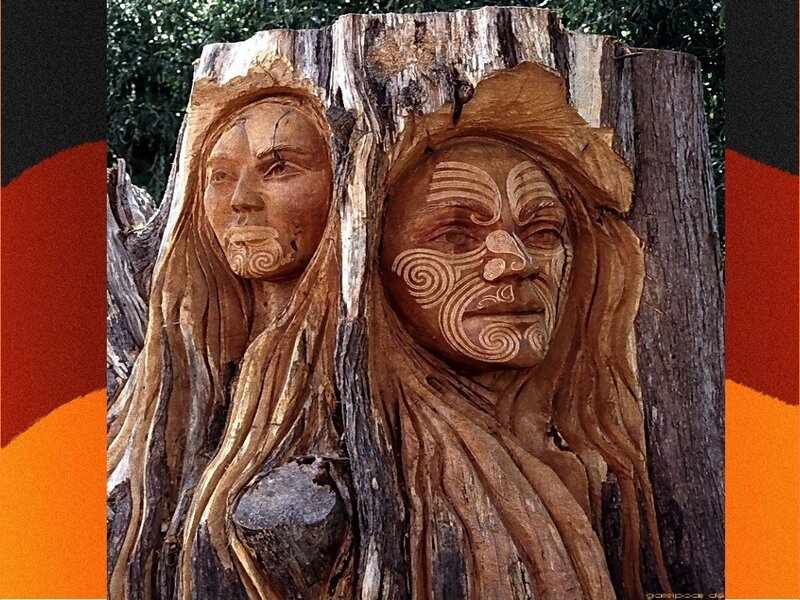 wood carving of two faces