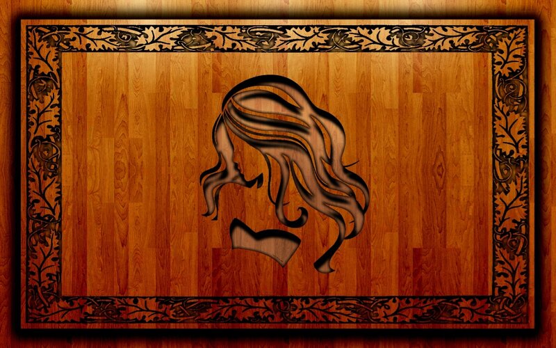 wood carving of woman's profile
