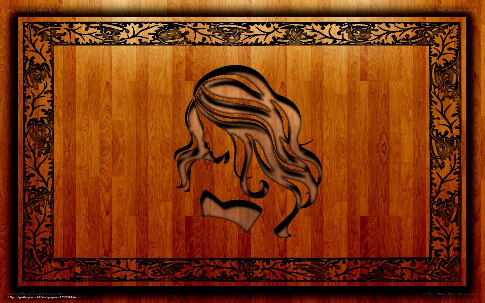 wood carving of woman's profile