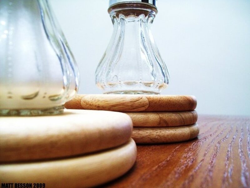 wood coasters with glass bottles