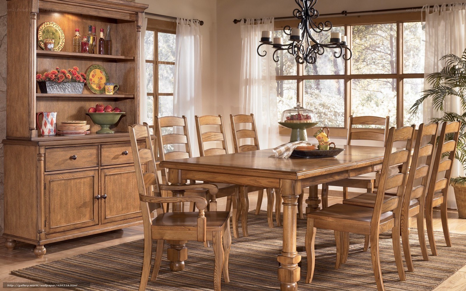 wood dining set in sunlit room