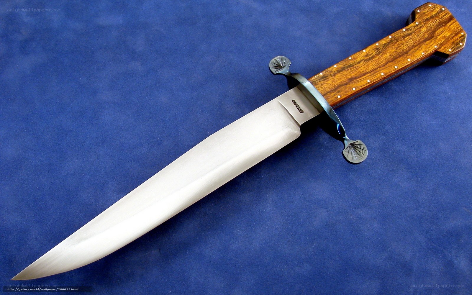 wood-handled knife on blue