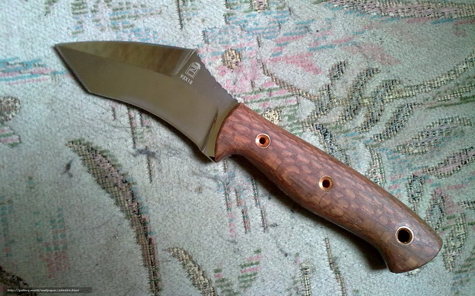 wood-handled knife on fabric