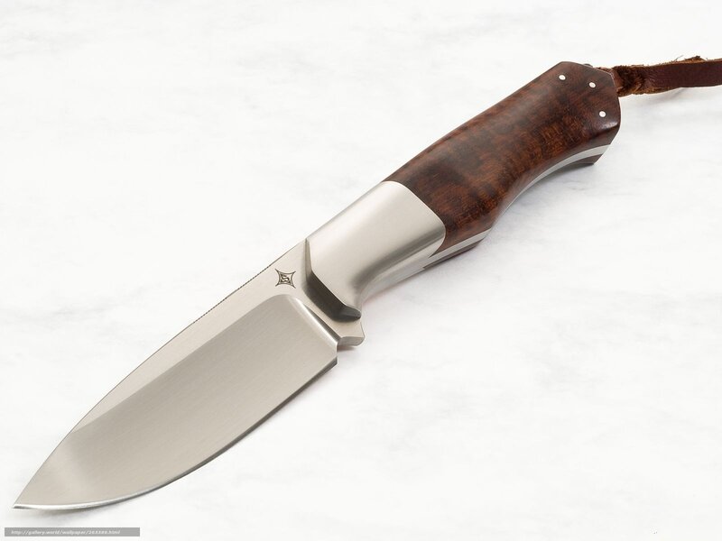 wood-handled knife on marble