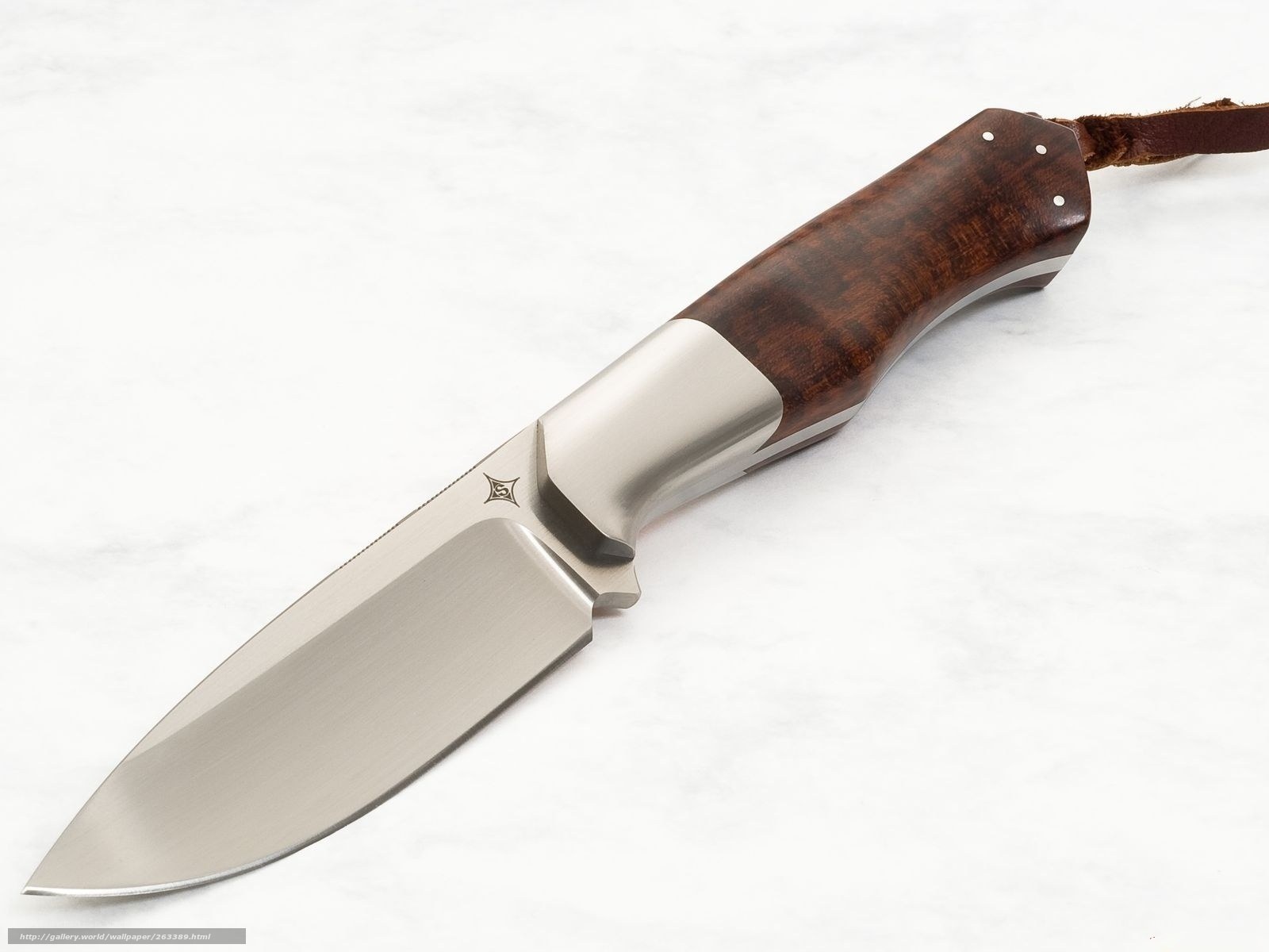wood-handled knife on marble