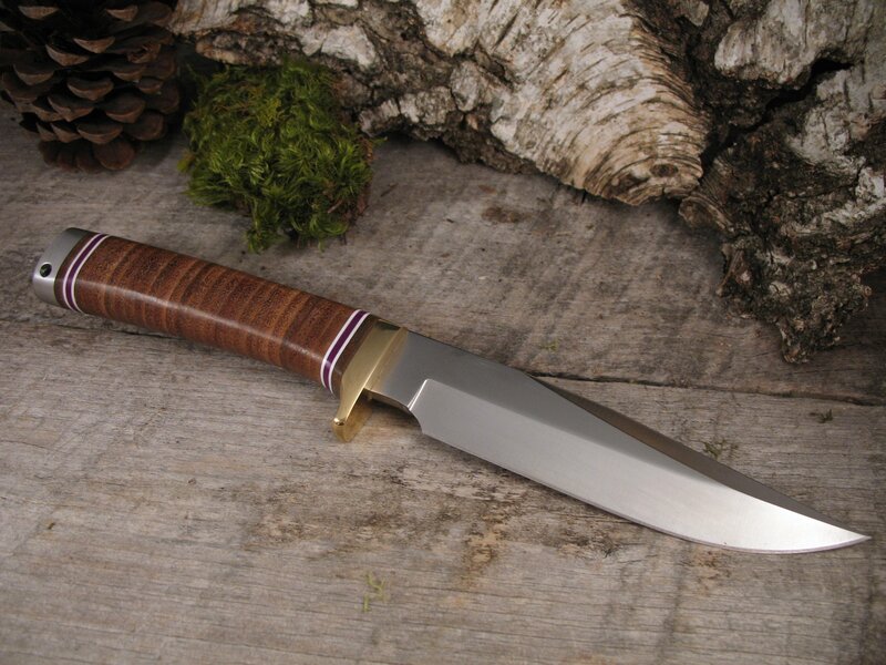 wood-handled knife on rustic surface