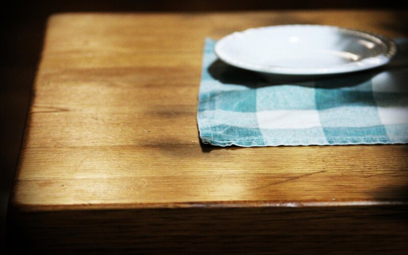 Wood table with plate and napkin