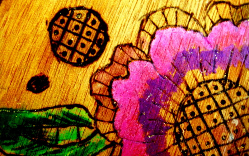 woodburning art with flowers