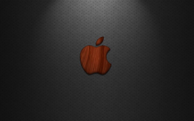 wooden apple logo on dark background