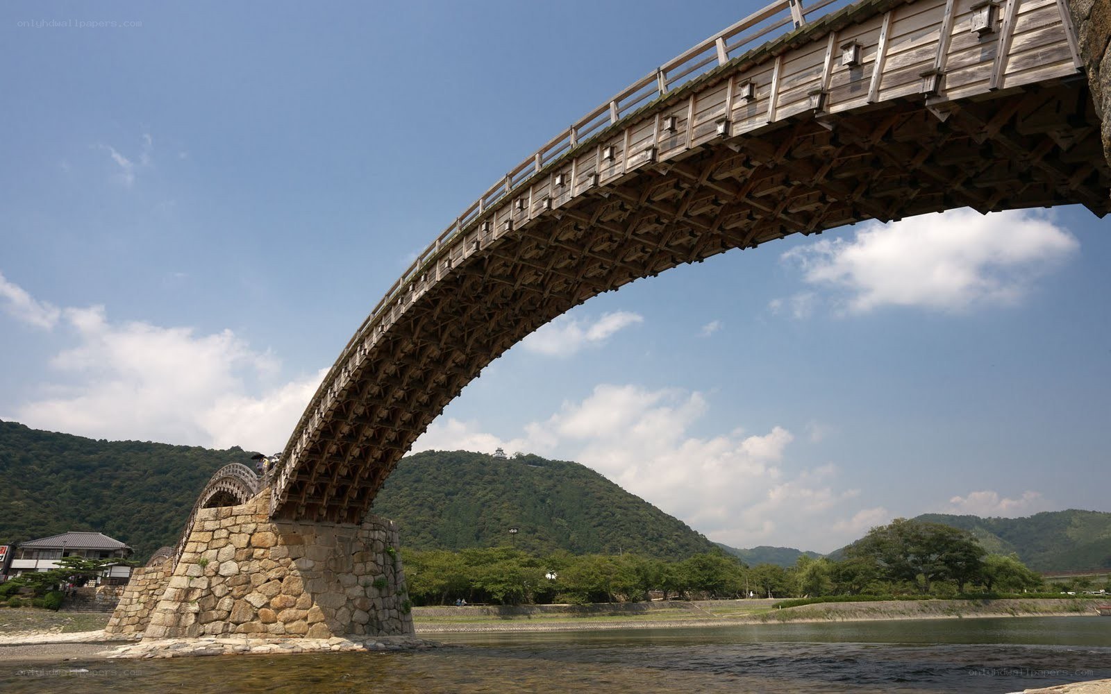 Wooden arch bridge over river